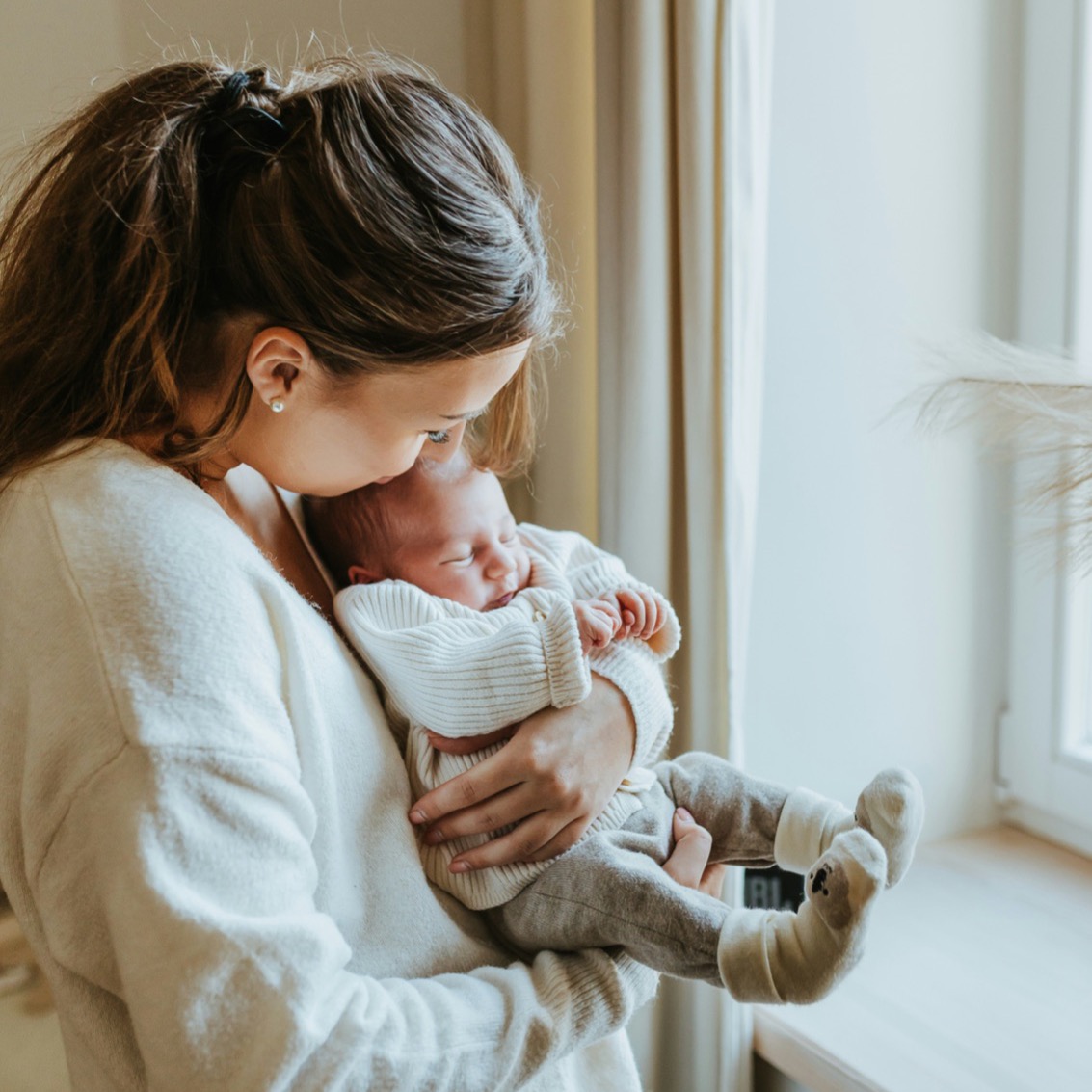 Mother holding her newborn